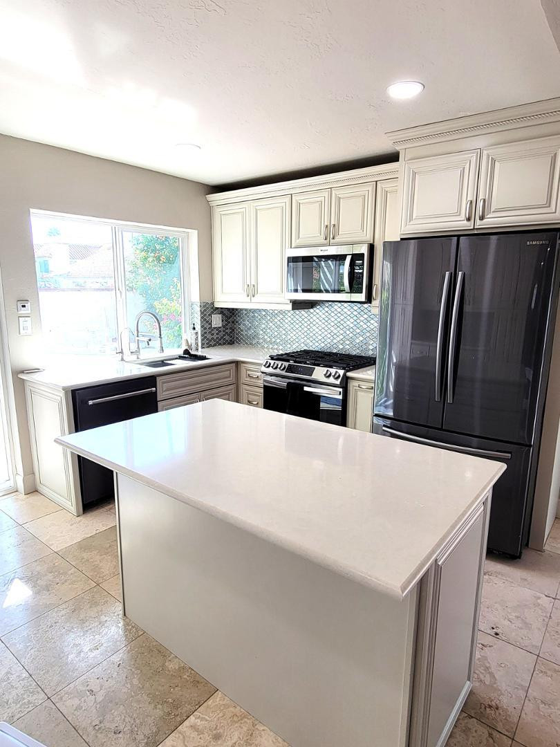 5770 North Scottsdale Road Paradise Valley, AZ 85253 - Photo 8 of 25 a kitchen with stainless steel appliances a refrigerator sink and microwave