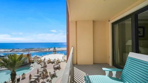 a view of a balcony with chairs