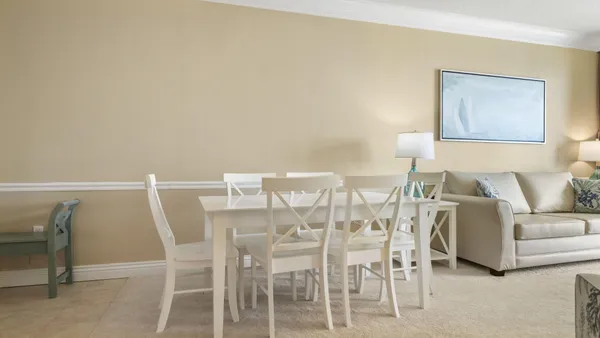 a living room with furniture and a table