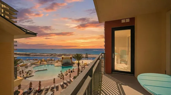 a view of a balcony with an ocean view