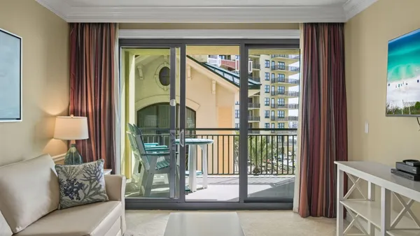a view of a porch with a floor to ceiling window