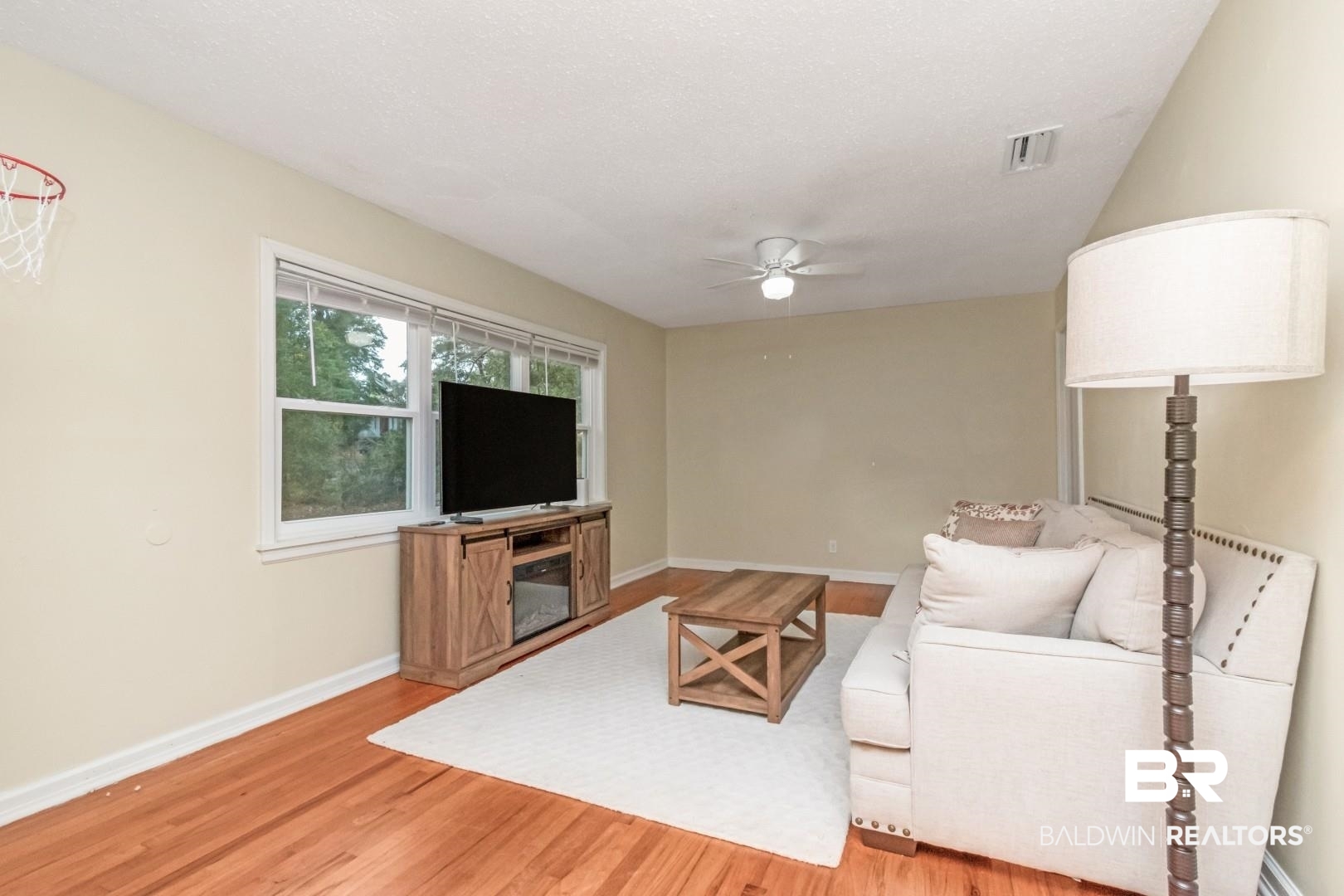61 Nack Lane Mobile, AL 36608 - Photo 3 of 25 Living room featuring ceiling fan and hardwood / wood-style floors