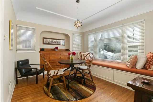 a dining room with furniture and window