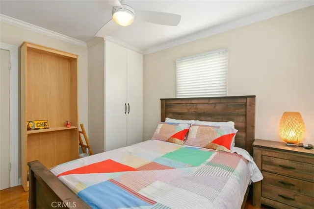 a bedroom with a bed and a lamp