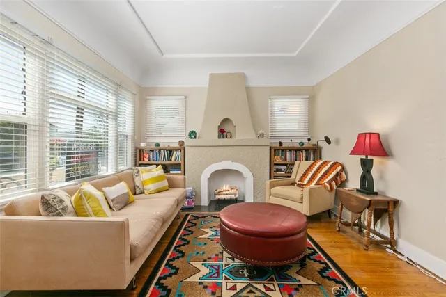 a living room with furniture and a fireplace