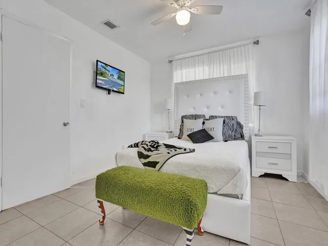 a bathroom with a toilet sink and shower
