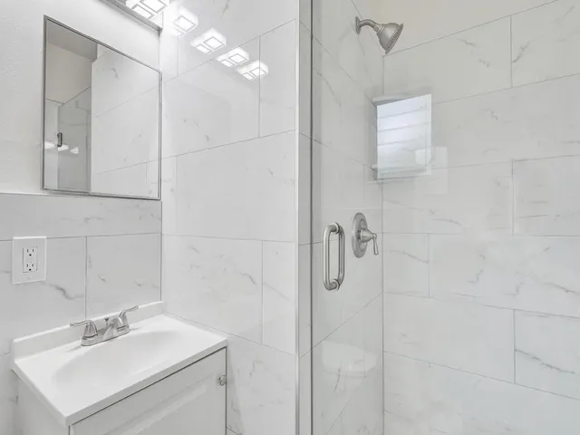 an aerial view of a house with a lake view