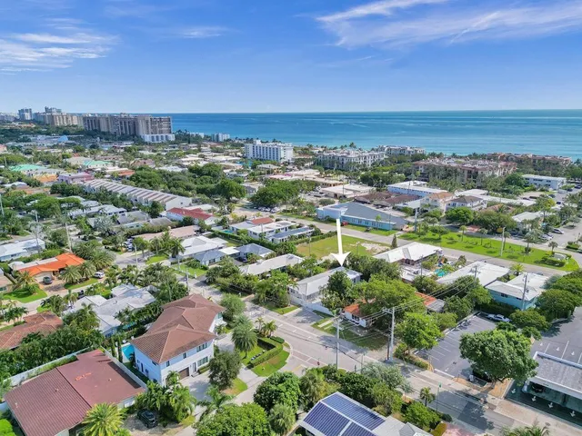 an aerial view of residential houses with outdoor space