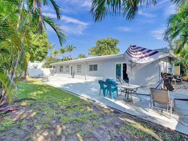 a view of a backyard with a sitting area and furniture