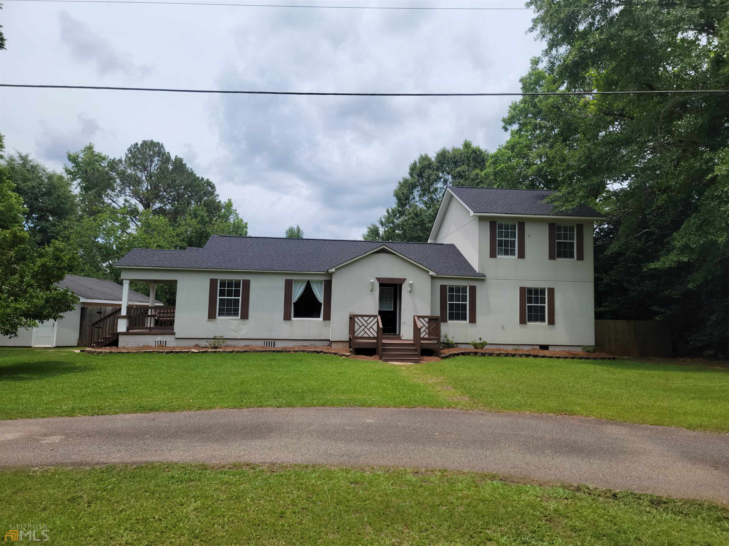 1494 Judge Brown Road Valley, AL 36854 - Photo 1 of 1 a front view of a house with a garden