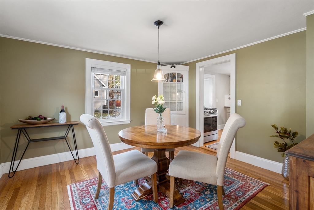 21 Summer Street Sudbury, MA 01776 - Photo 12 of 24 a dining room with furniture and wooden floor