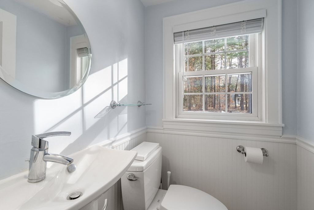 21 Summer Street Sudbury, MA 01776 - Photo 14 of 24 a bathroom with a toilet sink and mirror