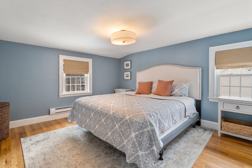 21 Summer Street Sudbury, MA 01776 - Photo 16 of 24 a bedroom with a bed and a window