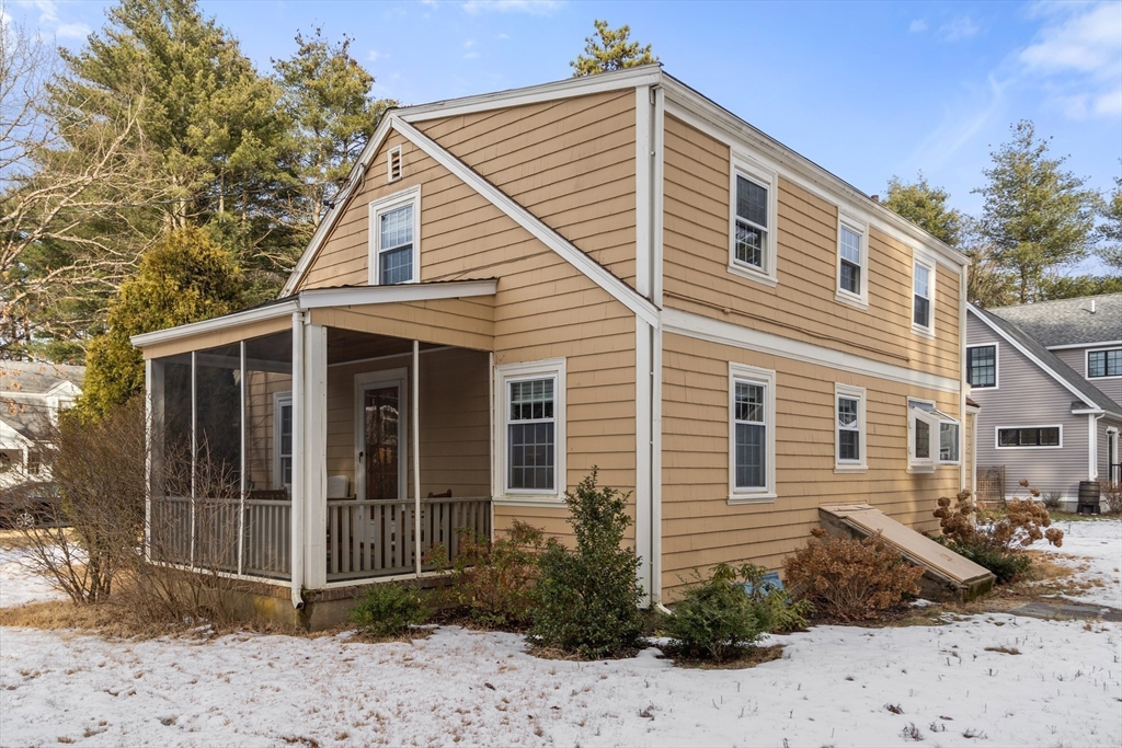 21 Summer Street Sudbury, MA 01776 - Photo 22 of 24 a view of a house with a small yard and wooden fence
