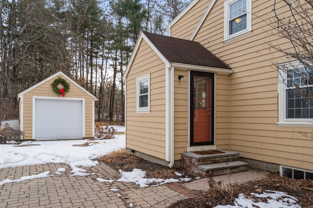 21 Summer Street Sudbury, MA 01776 - Photo 3 of 24 a front view of a house with a yard