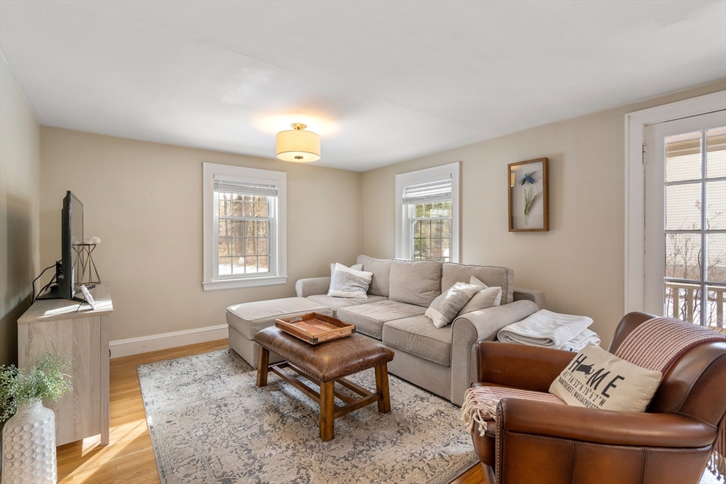 21 Summer Street Sudbury, MA 01776 - Photo 8 of 24 a living room with furniture a window and a flat screen tv
