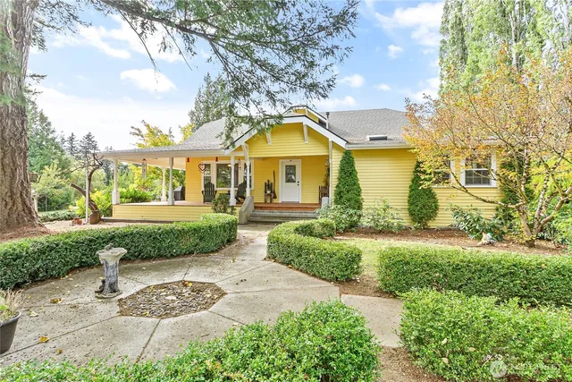 a front view of a house with garden