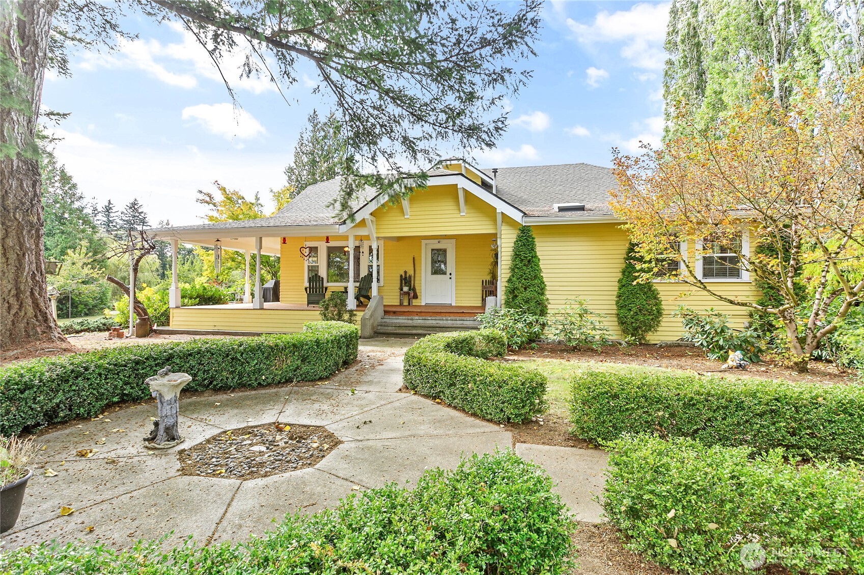 a front view of a house with garden