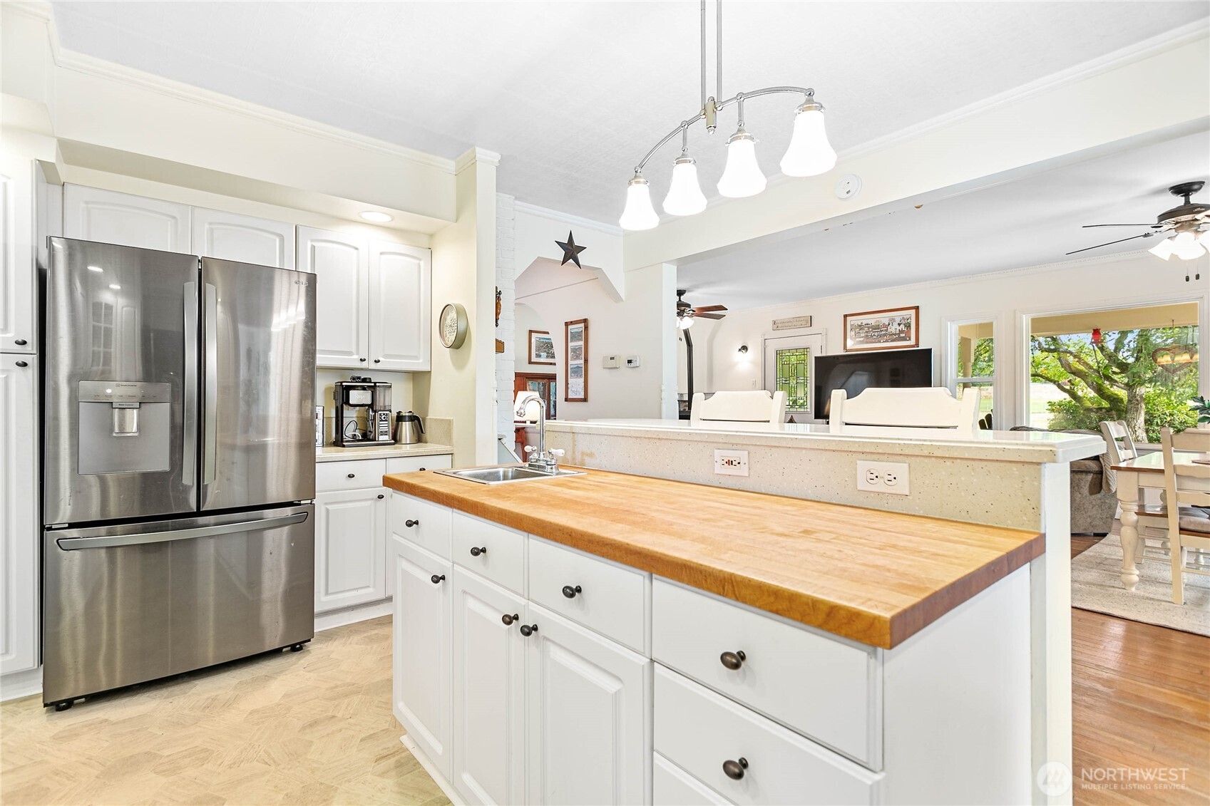 8731 Valley View Road Custer, WA 98240 - Photo 14 of 40 a kitchen with stainless steel appliances kitchen island granite countertop a refrigerator a stove and a sink with cabinets