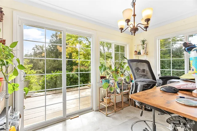 a bedroom with bed and a book shelf