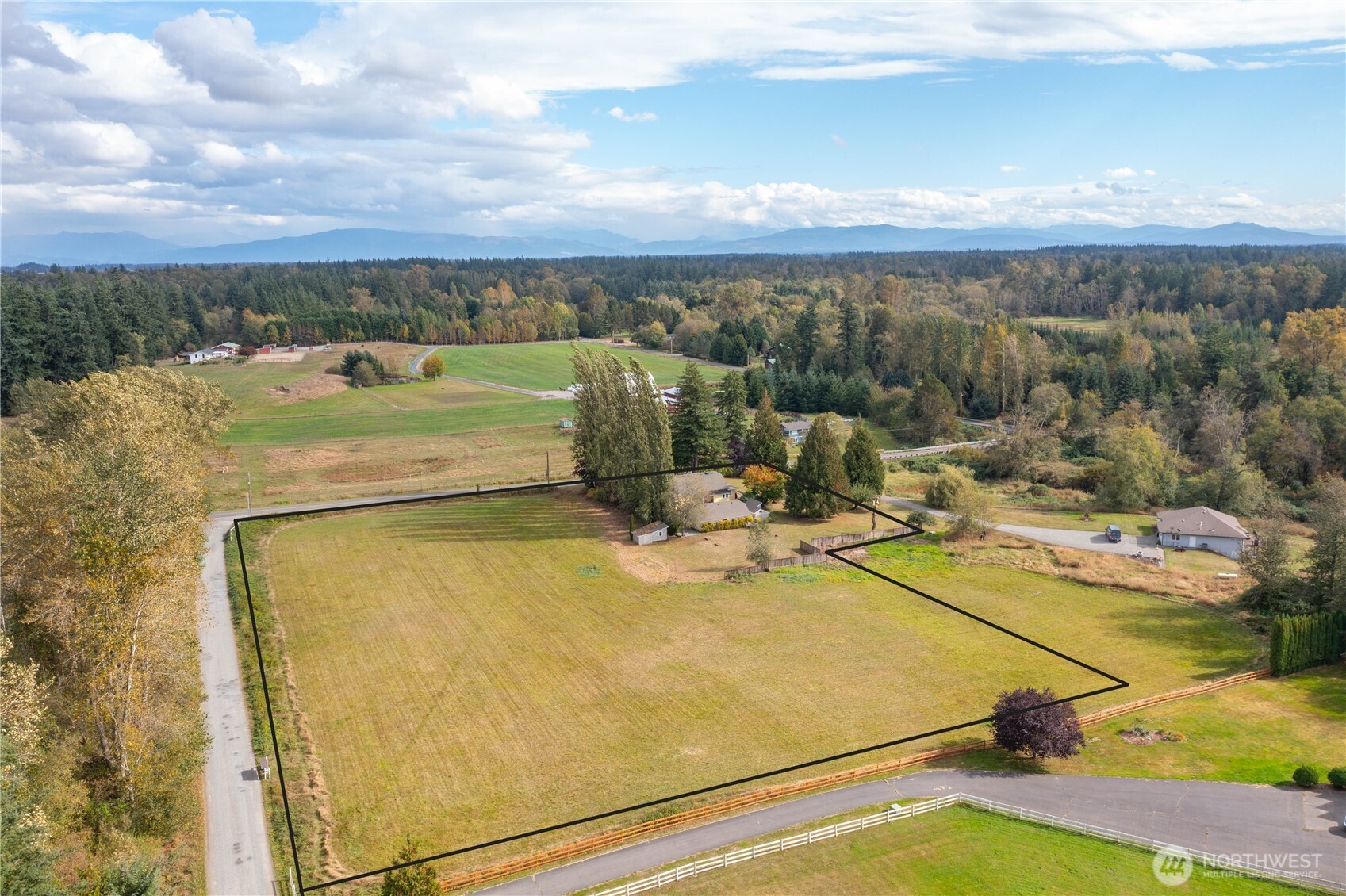 8731 Valley View Road Custer, WA 98240 - Photo 2 of 40 a view of a swimming pool with an outdoor seating