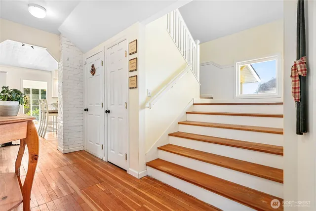 a bedroom with a bed and a television