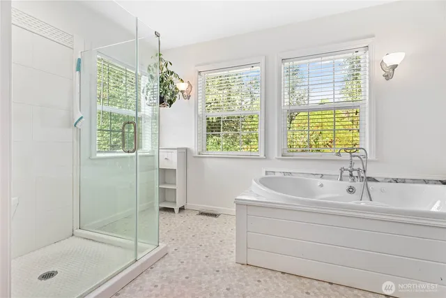 a bedroom with a bed and a television