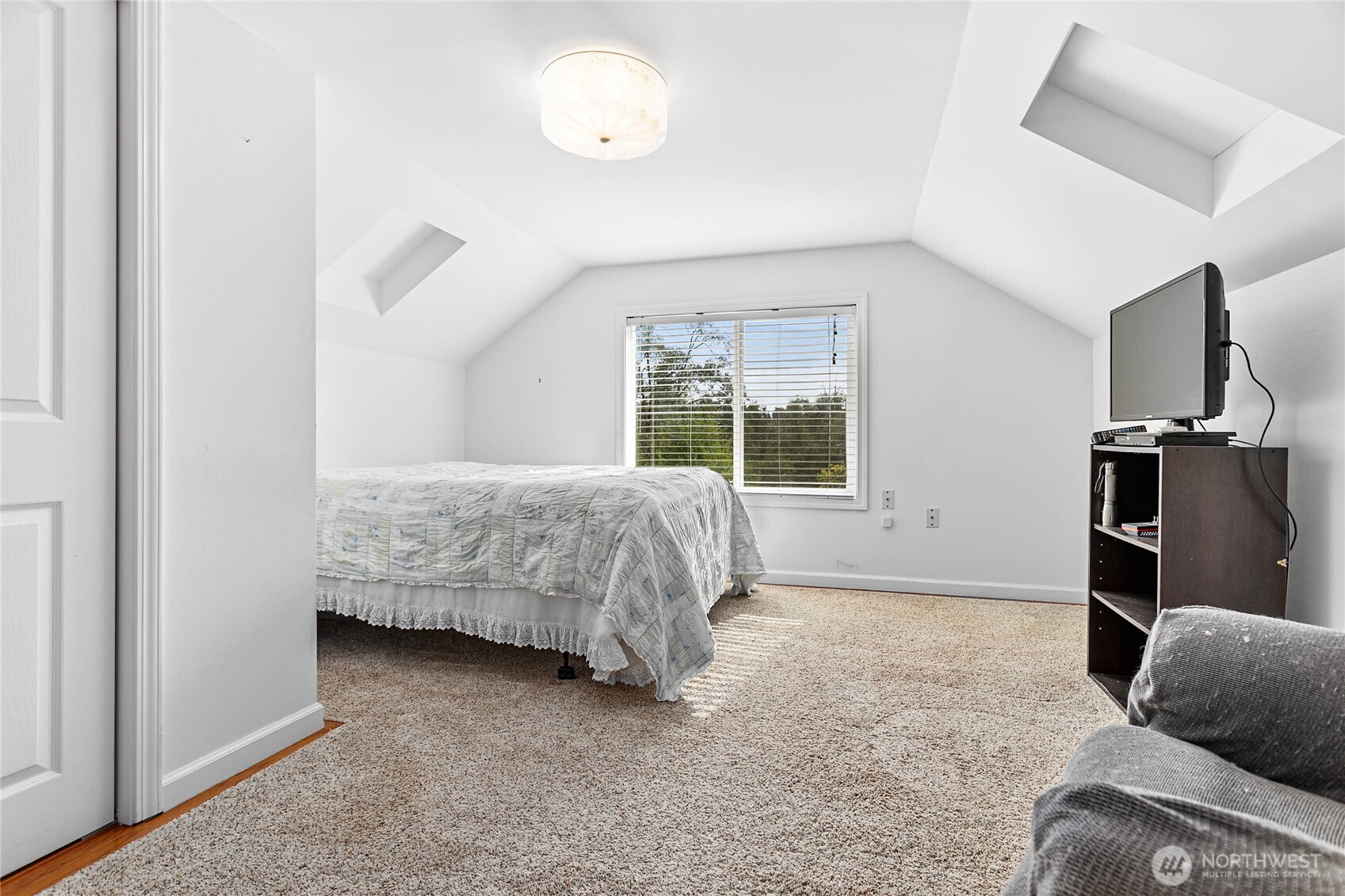 8731 Valley View Road Custer, WA 98240 - Photo 24 of 40 a bedroom with a bed and a television