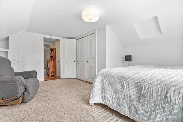 a bathroom with a sink toilet and a mirror