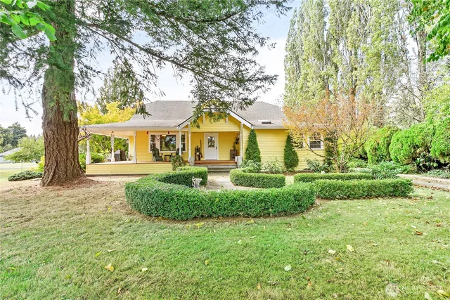 a view of a patio with table and chairs and potted plants