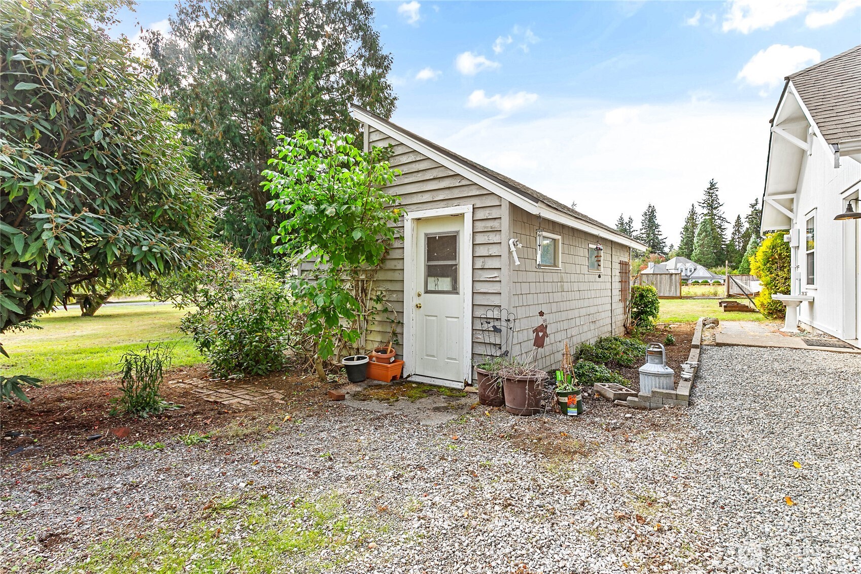 8731 Valley View Road Custer, WA 98240 - Photo 32 of 40 a view of backyard with outdoor seating and trees