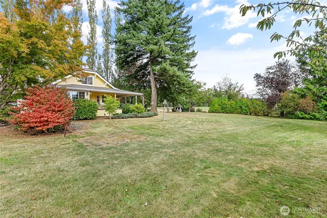 a view of a lake with a yard