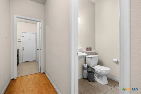 a bathroom with a toilet and a sink