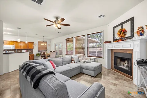 a living room with furniture and a fireplace