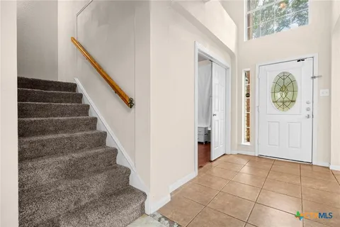 a view of an entryway with staircase