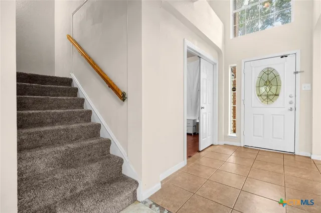 a view of an entryway with staircase