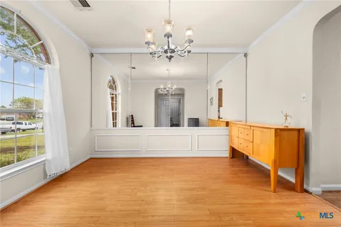 a view of living room with granite countertop furniture and a chandelier