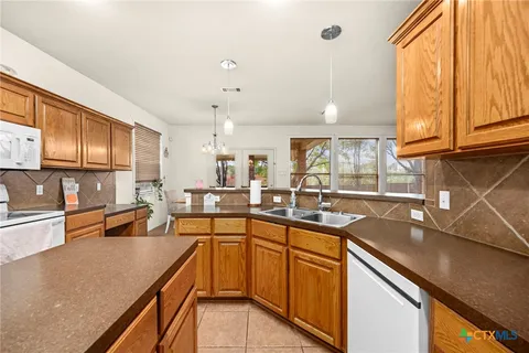 a kitchen with lots of counter top space and center island