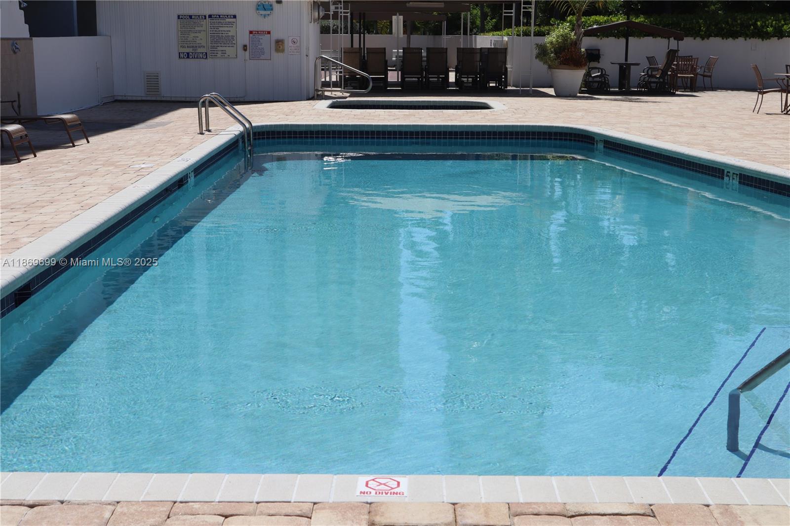 17801 North Bay Road, Unit 203 Sunny Isles Beach, FL 33160 - Photo 11 of 23 a swimming pool with outdoor seating