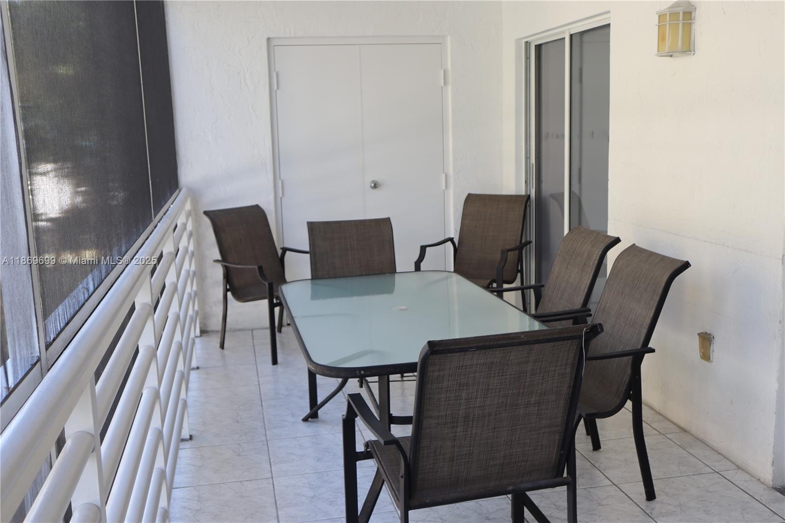17801 North Bay Road, Unit 203 Sunny Isles Beach, FL 33160 - Photo 7 of 23 a view of a dining room with furniture and wooden floor