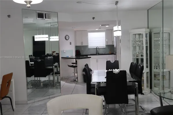 a dining room with furniture and window