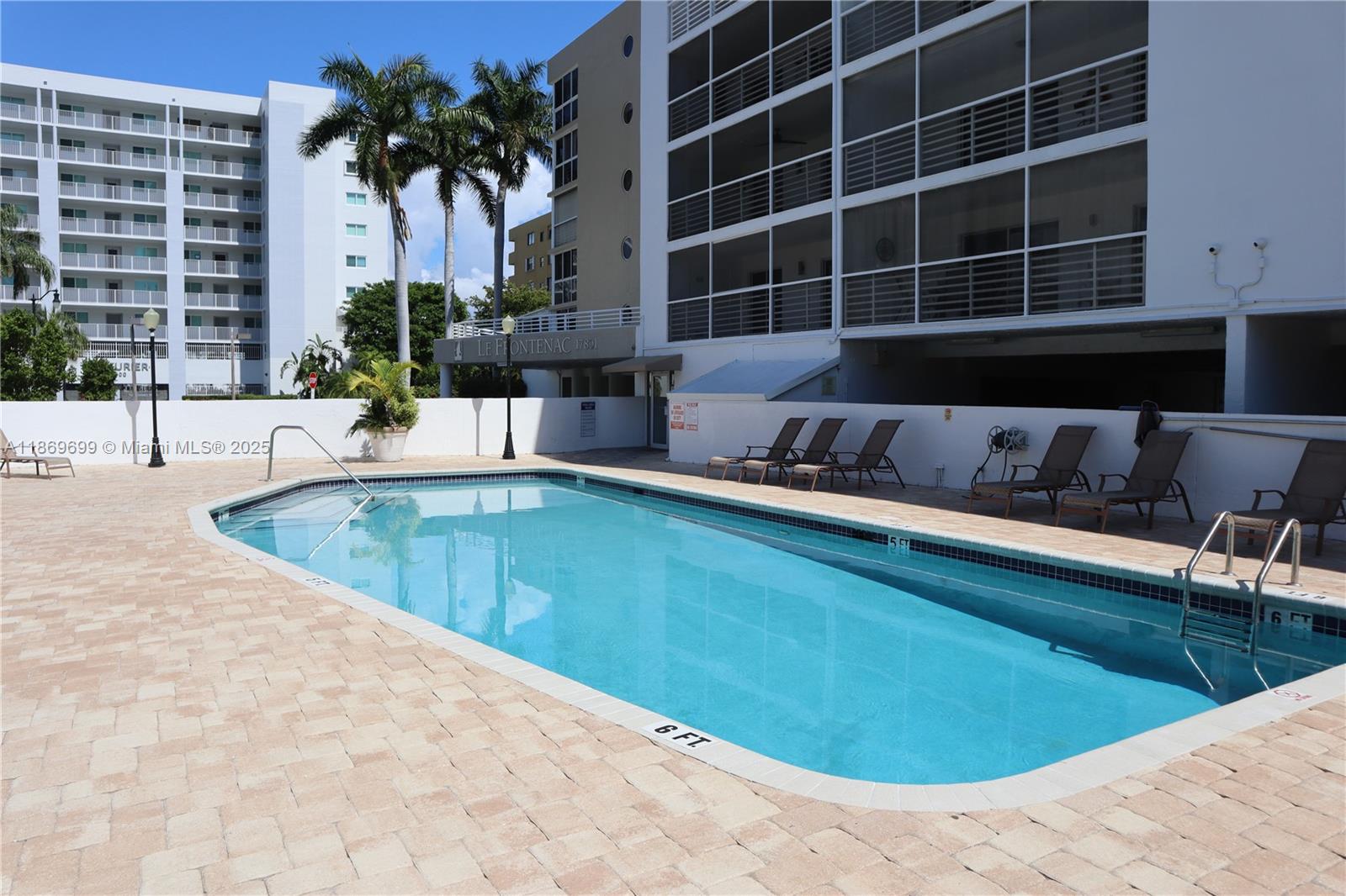 17801 North Bay Road, Unit 203 Sunny Isles Beach, FL 33160 - Photo 10 of 23 a view of a swimming pool with a lounge chair