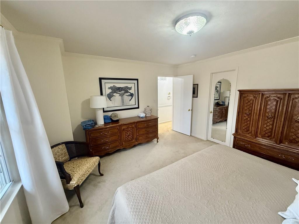 5705 Orly Terrace Atlanta, GA 30349 - Photo 11 of 42 a bedroom with furniture and wooden floor