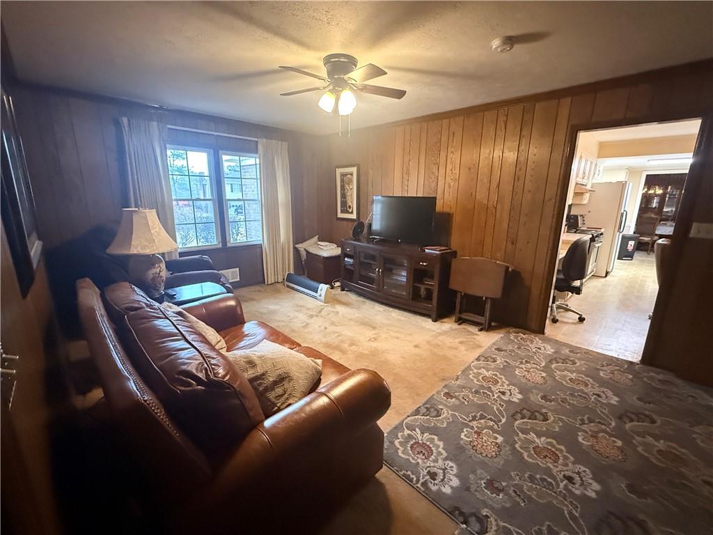 5705 Orly Terrace Atlanta, GA 30349 - Photo 19 of 42 a living room with furniture and a flat screen tv
