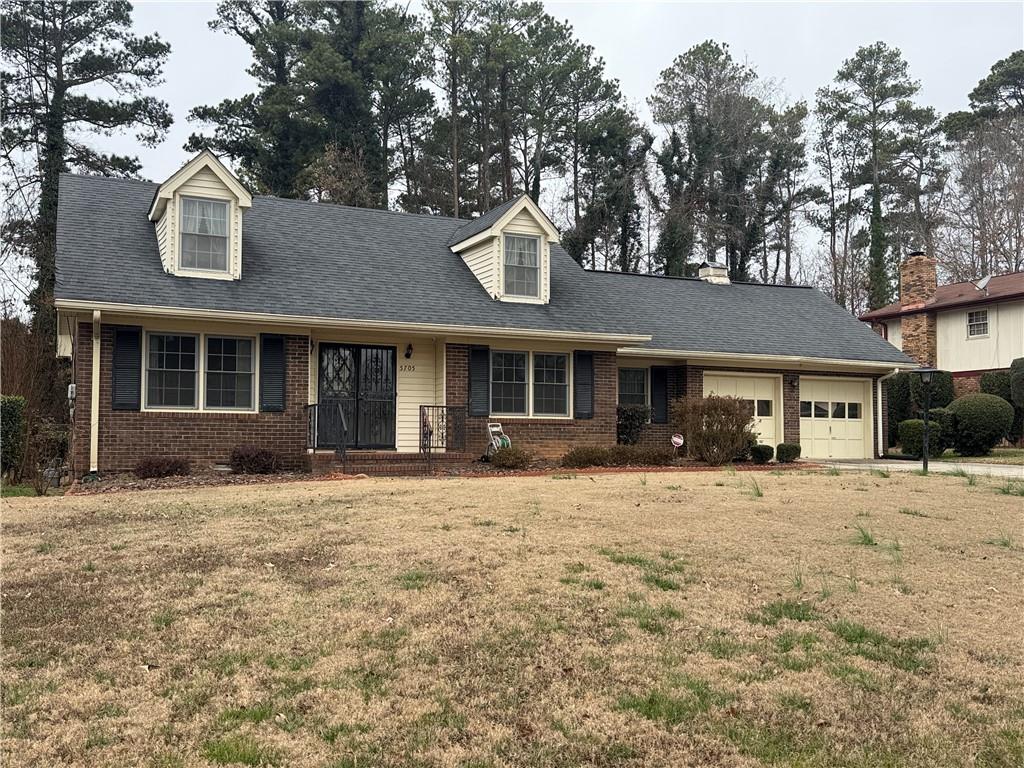 5705 Orly Terrace Atlanta, GA 30349 - Photo 2 of 42 a front view of a house with a yard