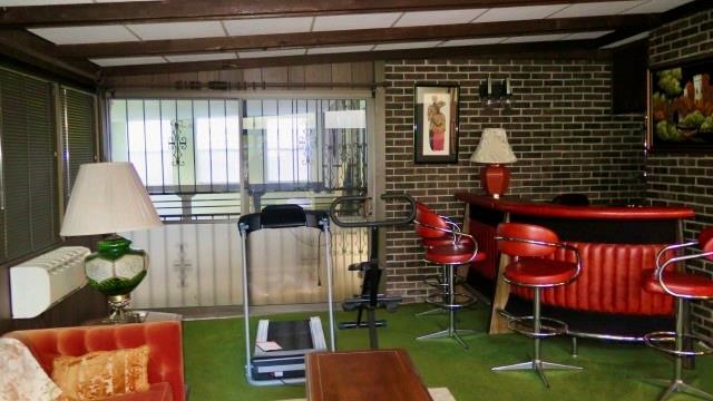 5705 Orly Terrace Atlanta, GA 30349 - Photo 26 of 42 a backyard of a house with barbeque oven table and chairs