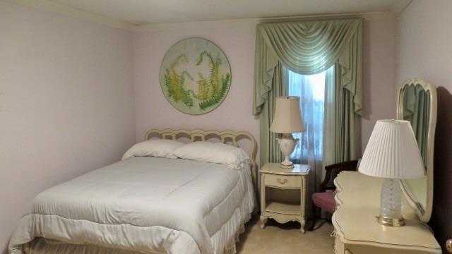 5705 Orly Terrace Atlanta, GA 30349 - Photo 33 of 42 a bedroom with a bed and a mirror