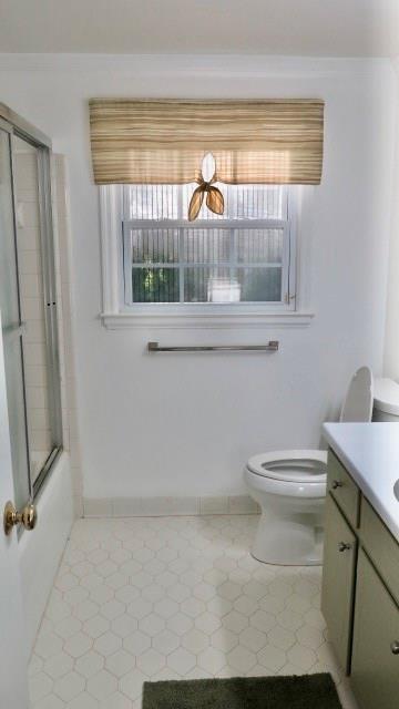 5705 Orly Terrace Atlanta, GA 30349 - Photo 35 of 42 a bathroom with a toilet a sink and a window