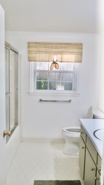 5705 Orly Terrace Atlanta, GA 30349 - Photo 36 of 42 a bathroom with a toilet a sink and a window