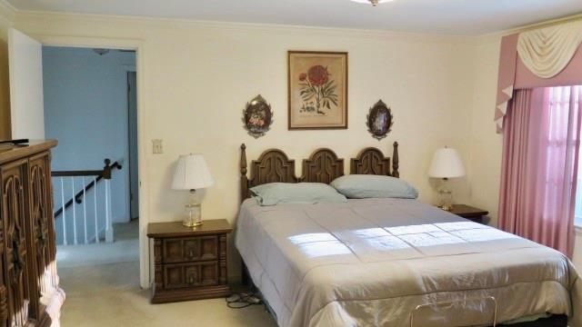 5705 Orly Terrace Atlanta, GA 30349 - Photo 37 of 42 a bedroom with a bed and painting on the wall